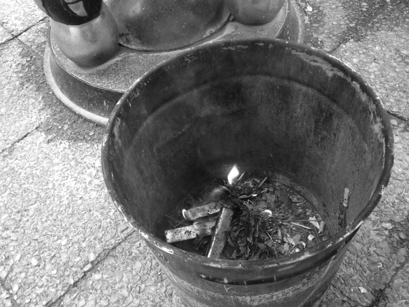 Vessel for burning paper gold lingots, street in Hanoi, January 23, 2012. 